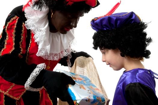 Zwarte piet ( black pete) typical Dutch character part of a traditional event celebrating the birthday of  Sinterklaas in december over white background with young child