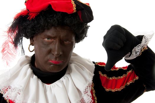 Zwarte piet ( black pete) typical Dutch character part of a traditional event celebrating the birthday of  Sinterklaas in december over white background with thumbs down