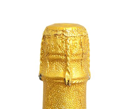 Neck of closed champagne bottle packed in golden paper over white background