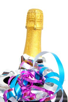 Neck of closed champagne bottle packed in golden paper over white background