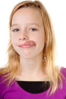 young girl makes funny face in closeup over white background