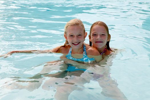girls are heaving fun in the swim pool