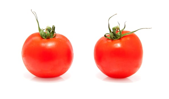 Two fresh tomatoes isolated on white background
