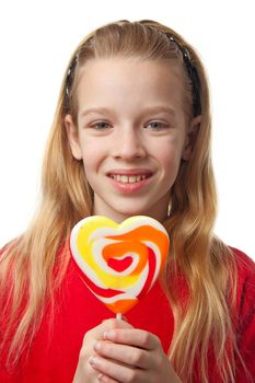 Young blonde girl with lollipop over white background