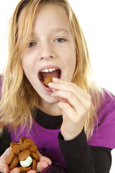 Girl with ginger nuts ( pepernoten ) for Sinterklaas, traditional in the netherlands, over white background