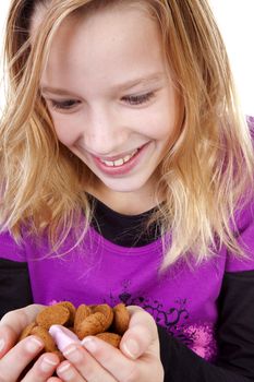 Girl with ginger nuts ( pepernoten ) for Sinterklaas, traditional in the netherlands, over white background