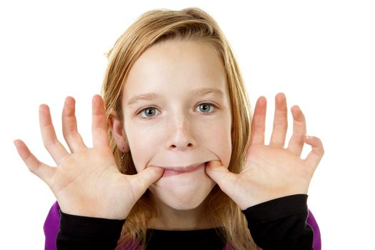 girl is making funy face in closeup over white background