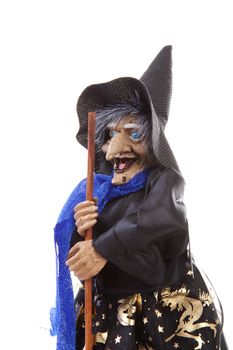 witch doll for halloween over white background
