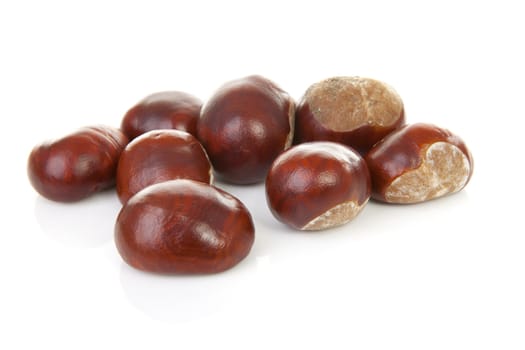 couple of chestnuts isolated on white background