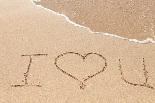 Inscription on the beach Love you