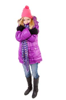 young girl in winter outfit heaving cold over white background