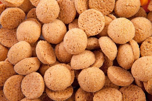 background of typical dutch sweets: pepernoten (ginger nuts) for a celebration at 5 december in the Netherlands