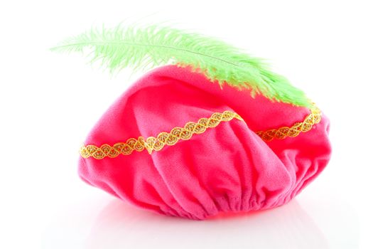pink hat with green feather of Zwarte Piet, typical Dutch event in december, isolated on white background