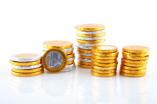 pile of chocolate euro money over white background