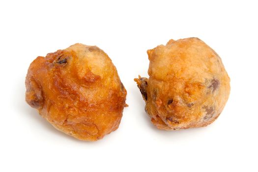 Two Dutch donut also known as oliebollen, traditional New Year's eve food isolated on white background