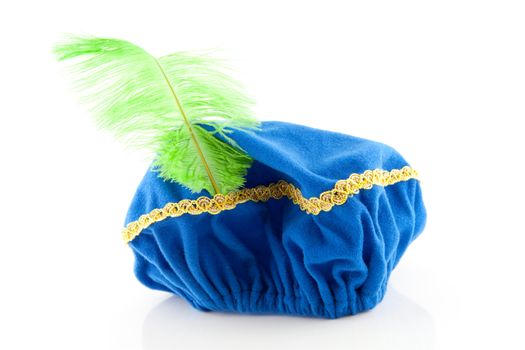 blue hat with green feather of Zwarte Piet, typical Dutch event in december, isolated on white background