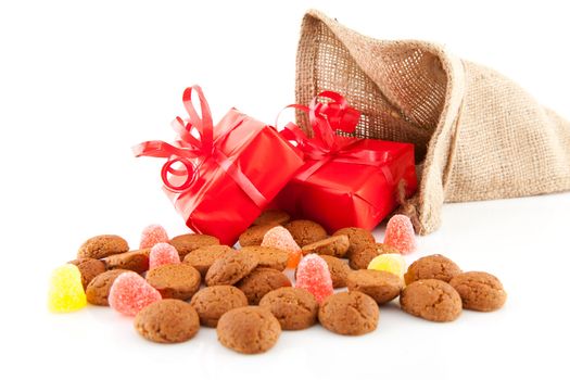 Typical Dutch celebration: Sinterklaas with surprises in bag and ginger nuts, ready for the kids in december. Isolated on white background