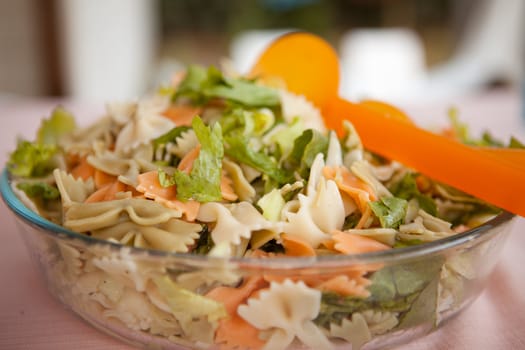 Fresh salad with pasta in closeup