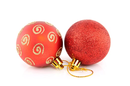 Two red christmas balls isolated on white background