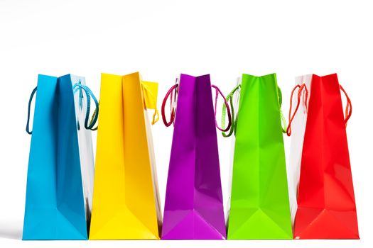 four shopping bags in a row on white background