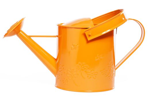 orange watering can on white background