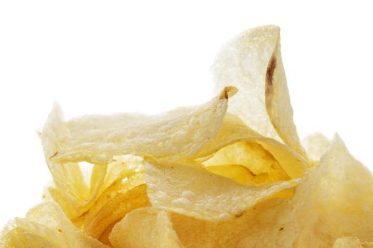  closeup of salted potato chips on white background