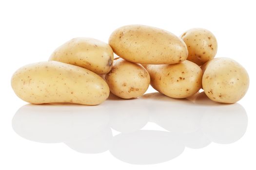 pile of raw potatoes on white background