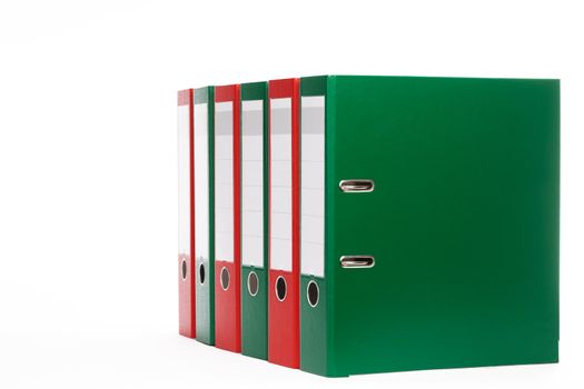 red and green office ring binders on white background