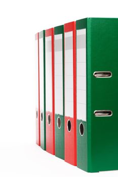green and red office ring binders on white background