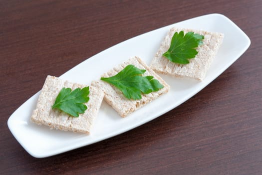 Diet bread with parsley on a plate