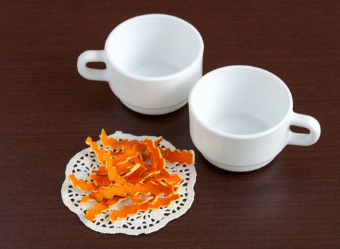 Dried orange peels and cups