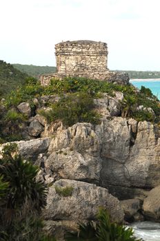 mayn ruins named God of Winds Temple on beach in tulum, mexico