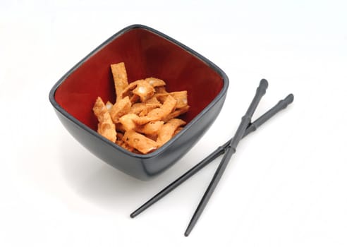 fried chinese food appetizer with chopsticks