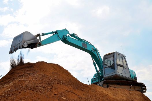 Excavators are heavy construction equipment consisting of a boom, bucket and cab on a rotating platform.