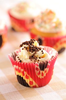 Cupcakes with whipped cream and icing