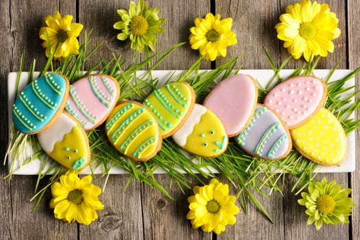 Easter homemade gingerbread cookie over wooden table