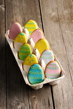 Easter homemade gingerbread cookie over wooden table