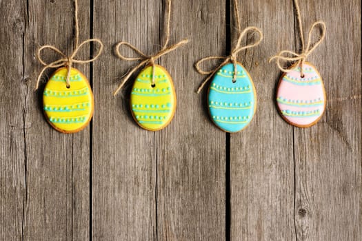 Easter homemade gingerbread cookie over wooden table