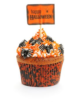 Halloween cupcake with whipped cream and decoration isolated on white