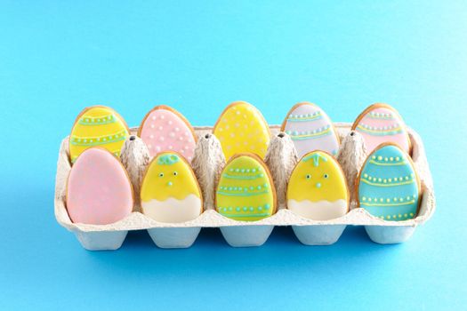 Easter homemade gingerbread cookie over blue