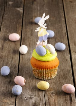 Easter homemade cupcake over wooden table