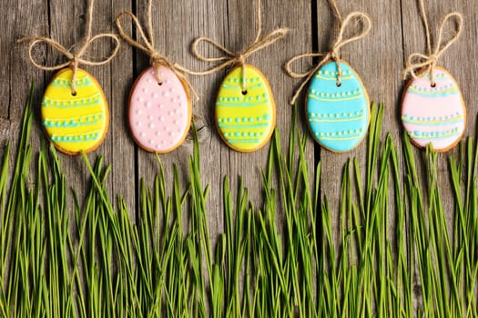 Easter homemade gingerbread cookie over wooden table