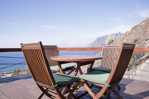 tenrife island with wooden chairs on tropical terrace