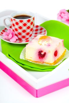 raspberry cake with coffee cup, in a tray for breakfast.