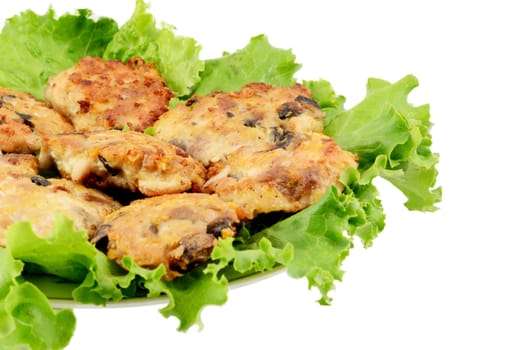 Cutlets minced on leaves of salad