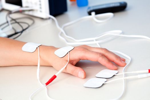 electrodes electric massage in physiotherapy room. tens therapy, nerve stimulation