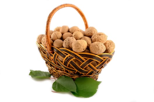 Basket full of nuts isolated on white background