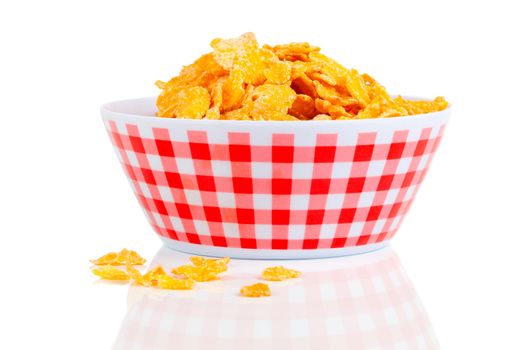 Cornflakes in a porcelain bowl, isolated on white background.