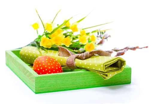 Easter egg with a serviette, in a tray for breakfast. isolated on white background.