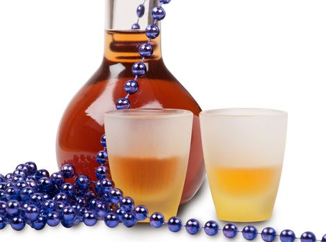 bottle of brandy, glasses and purple beads